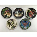 Five Moorcroft dishes, decorated with butterflies and flowers, approx 11.5cm in diameter.