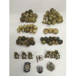 A collection of military buttons and badges.