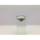 A 9ct white gold ring with a central heart design set with diamonds, approx 2.29g and approx size