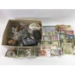 A collection of GB and foreign coinage and bank notes.