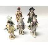 A collection of 19th Century Continental Porcelain figures some with marks in underglaze blue.