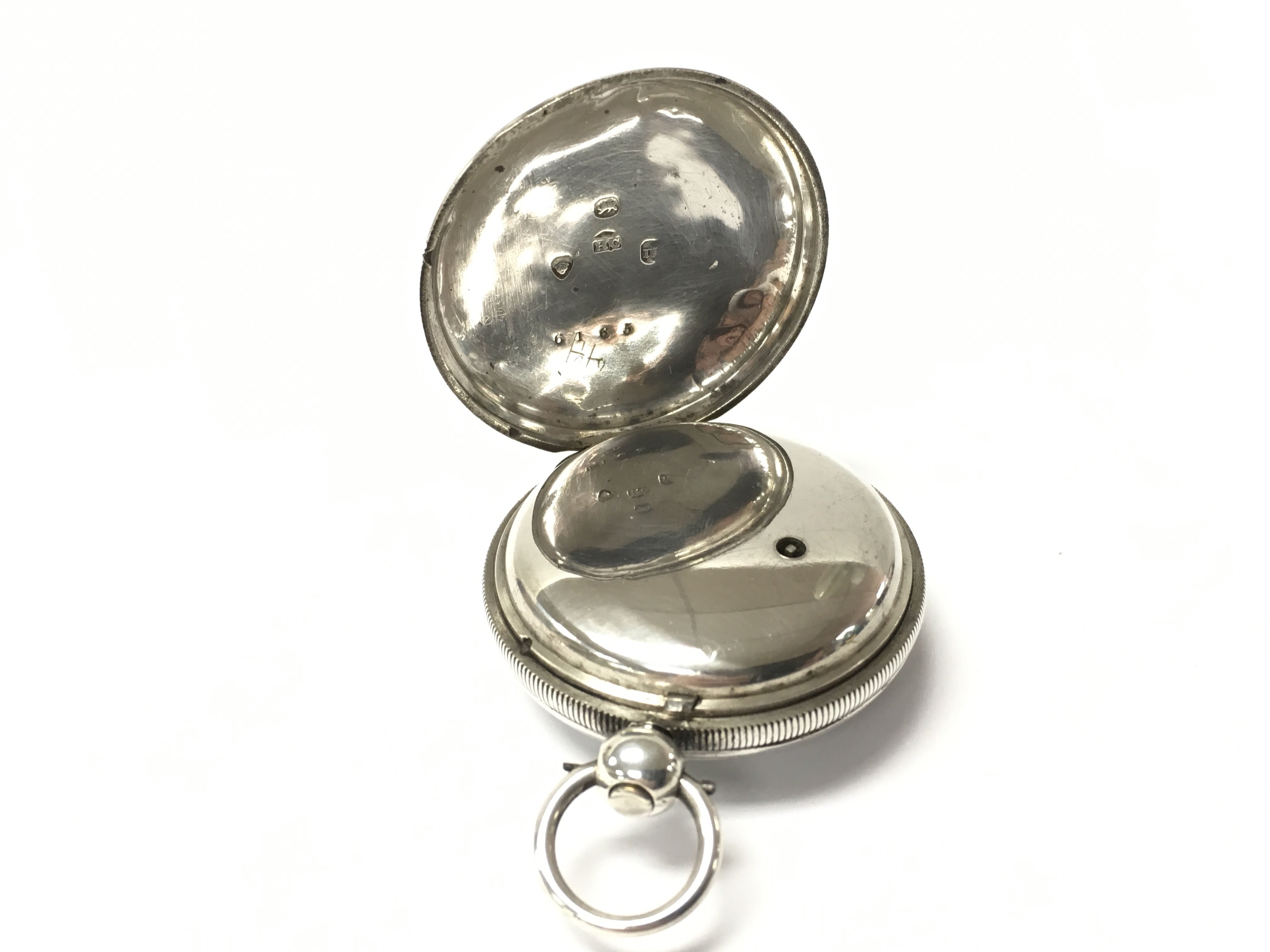 A silver cased pocket watch, the dial printed with a pastoral scene surrounded by Roman numerals. - Image 2 of 2