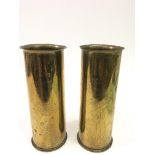 A pair of WW1 brass shell cases, both engraved with The Essex Regiment. Approx 22.5cm