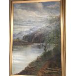 A Framed late Victorian oil painting on canvas view over a Scottish lake with mountains beyond