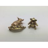 Two Harriet Glen 9ct gold brooches comprising on in the form of a pig set with ruby eyes and blue