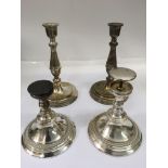 A pair of Elkington silver plated candlesticks and a pair of bases