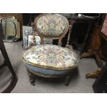 A Victorian ladies nursing chair, 1 caster missing.