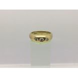 A gents 18ct gold three stone diamond gypsy ring, approx 0.5ct, approx 9.9g and approx size Q-R.