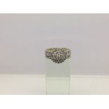 A 9ct gold diamond cluster ring, approx 1ct, approx 3.7g and approx size P.