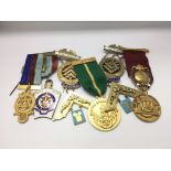 A collection of mostly Masonic silver gilt and metal medals, predominantly for a Beaconsfield