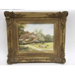 A framed English porcelain wall plaque hand-painted by Milwyn Holloway, depicting a rural cottage