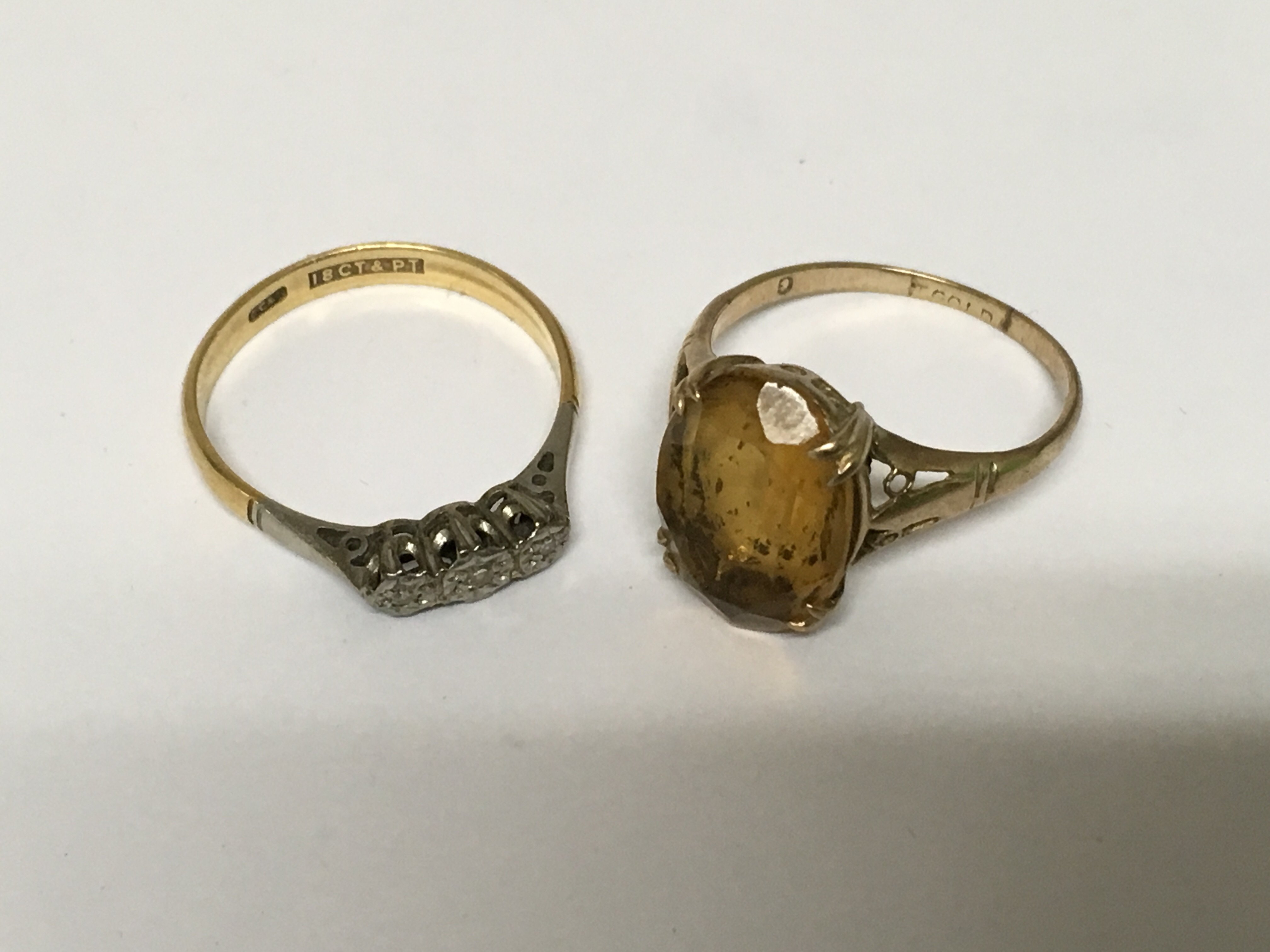 A 18ct gold ring inset with three diamond chips 2 grams approx and a 9ct gold ring 2 grams approx