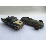 Tinplate friction drive Oldsmobile police car and a Mercedes tinplate friction drive racing car ,