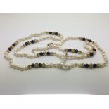 A pearl necklace with 14ct gold and lapis lazuli b