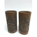 A pair of Chinese carved wood brush pots.Approx 22cm, a/f