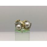 A pair of 18ct white gold, pearl and diamond earrings, approx 8g.
