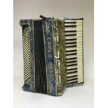 A Carlo Rossi accordion with blue enamelled style design.