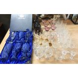 A small group of glassware including a boxed set of crystal wine glasses, an silver overlay