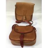 Two vintage leather tan saddlebags