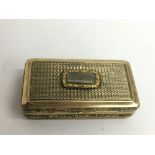 A fine Georgian, parcel gilt snuff box, the turned lid set with cabouchon stone.Approx 3x6cm