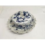A Meissen butter dish and cover decorated flowers and foliage