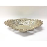 An ornate silver dish with Sheffield hallmarks. To