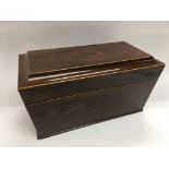 An inlaid oak tea caddy with mixing bowl and interior compartments all intact.