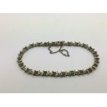 A 9ct gold bracelet set with emeralds and diamonds, approx 7g.