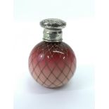 A silver topped, pink and gilded overlay glass scent bottle.Approx 10cm high - NO RESERVE