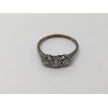 A three stone diamond ring, approx 1.6g and approx size J.