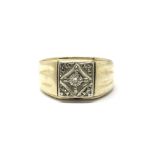 A gents 14ct gold ring set with a central diamond, ring size approx V/W, weight approx 7.2 grams.