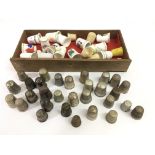 A small group of thimbles including silver example