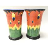 Two colourful Crown Ducal vases of Firefly pattern, of Art Deco inspiration. Measures approx 15.