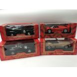 A collection of boxed 1:18 scale diecast vehicles including, Mira golden line, Ferrari F50,