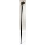 An unusual, silver mounted walking stick, the wooden head shaped and painted as a cockerel with