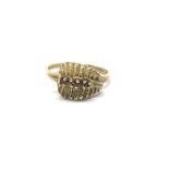 An ladies interesting 9ct gold ring set with a ban