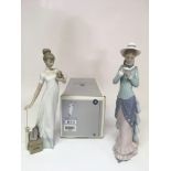 A boxed Lladro figure 'Travelling Companions' plus a young lady reading a book. No damage or