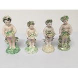 Four 19th century or possibly earlier English Porcelain figures of Putti holding baskets of