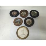 Five Victorian mounted pot lids and a gilt framed plaque.