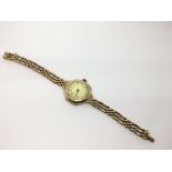 A lady's vintage 15ct gold watch on link bracelet strap.Approx 28.9ct