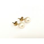 A pair of pearl earrings on 9ct gold studs.