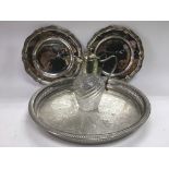 A pair of Elkington dishes, a circular tray and a small claret jug (4).