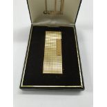 A cased Dunhill gold plated lighter