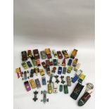 A small collection of playworn die -cast vehicles including a Corgi Batman car and boat