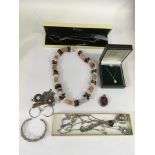 A group of silver jewellery and a polished hardstone necklaces