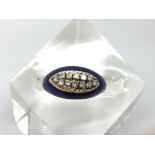 An unusual 18ct gold ring, having blue enamel mounted set with two rows of diamonds.Approx N, 5.