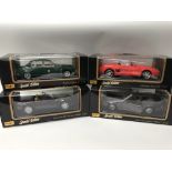 A collection of boxed 1:18 scale diecast vehicles including, Maisto special editions, Jaguar MK