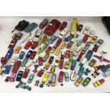 A collection of playworn die-cast vehicles including Corgi and Dinky E-Ttype Jaguar