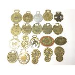 A collection of twenty five horse brasses to include examples from the London Van Horse Parade