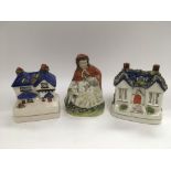 An early 19th Century Staffordshire figure of a lady plus two Staffordshire money boxes (3) - NO
